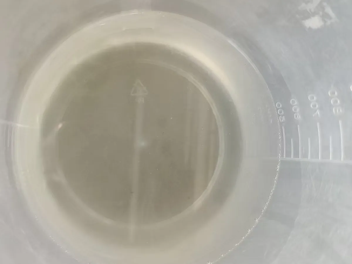 Polycarboxylate superplasticizer liquid prepared for measurement in a laboratory beaker