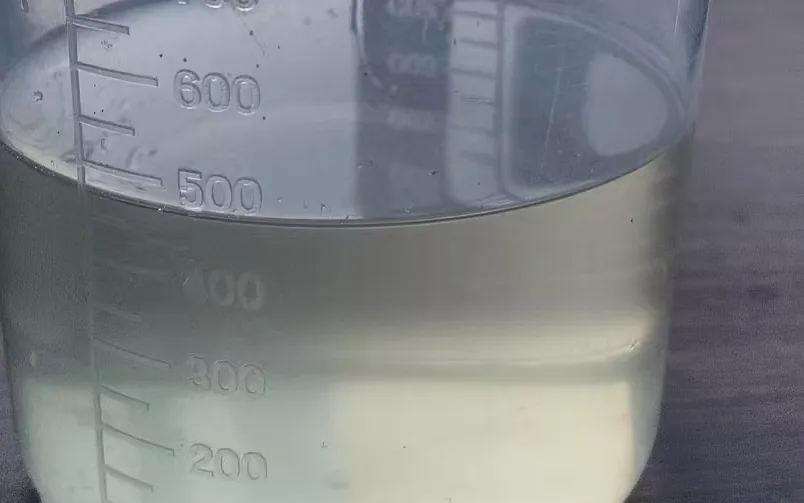 Polycarboxylate superplasticizer (PCE) liquid sample in a graduated cylinder